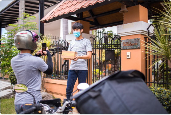Delivery drivers loading a truck with packages