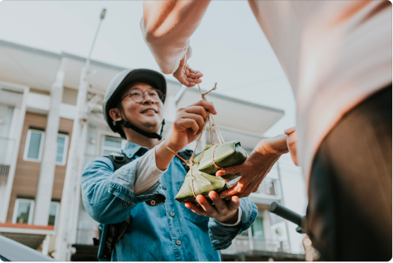 Delivery driver handing a package to a customer